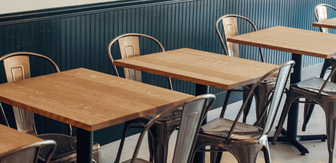 Picture of wooden tables and metal chairs in a café